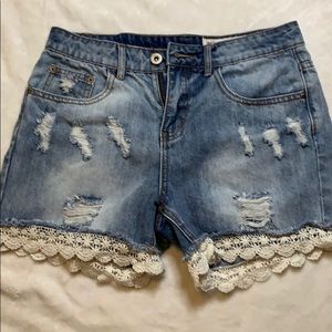 Distressed lace jeans